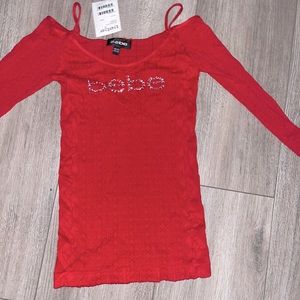BEBE new with tags off the shoulder stretch thin sweater.
